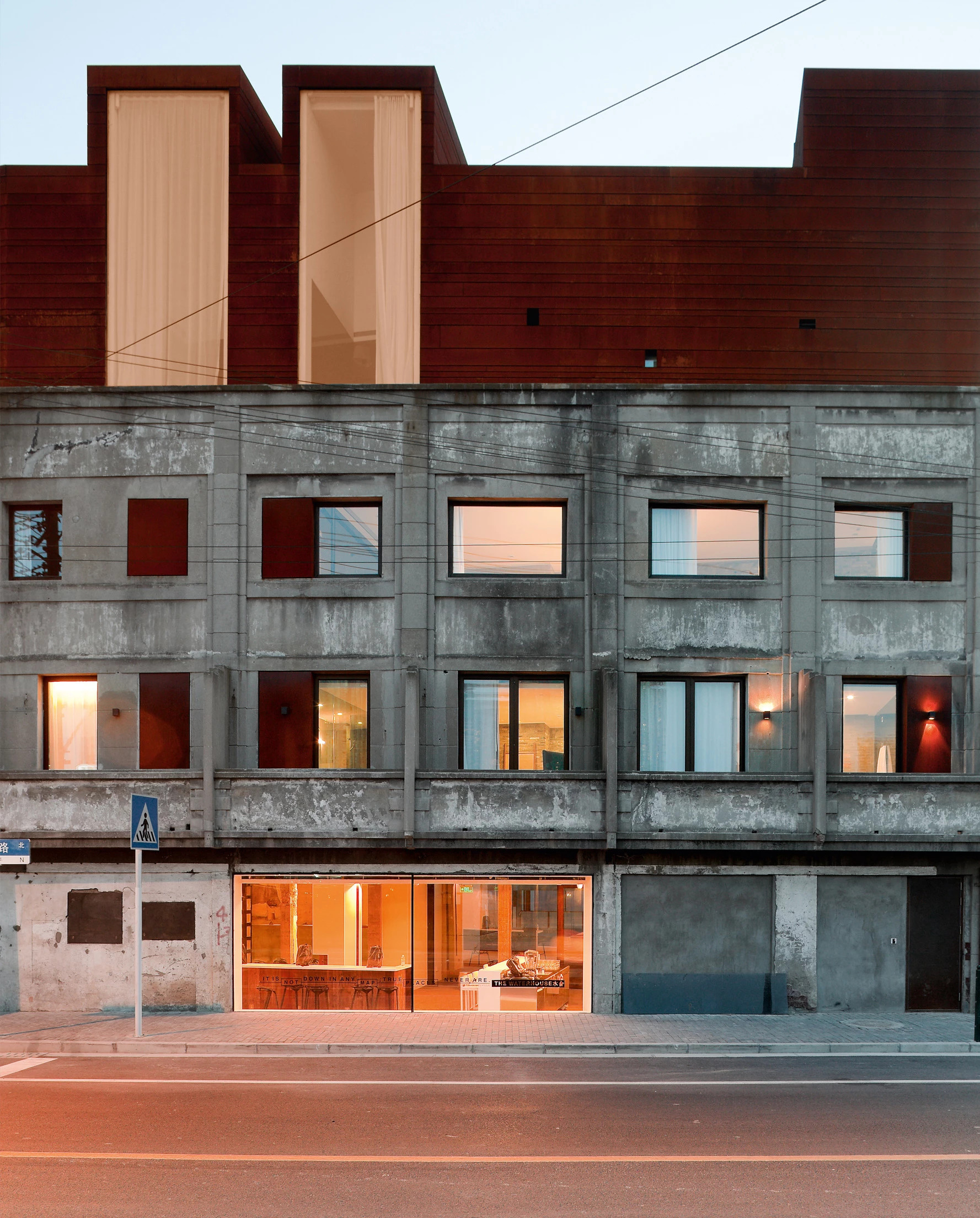 The kept concrete facade with later steel insertions, The Waterhouse at South Bund