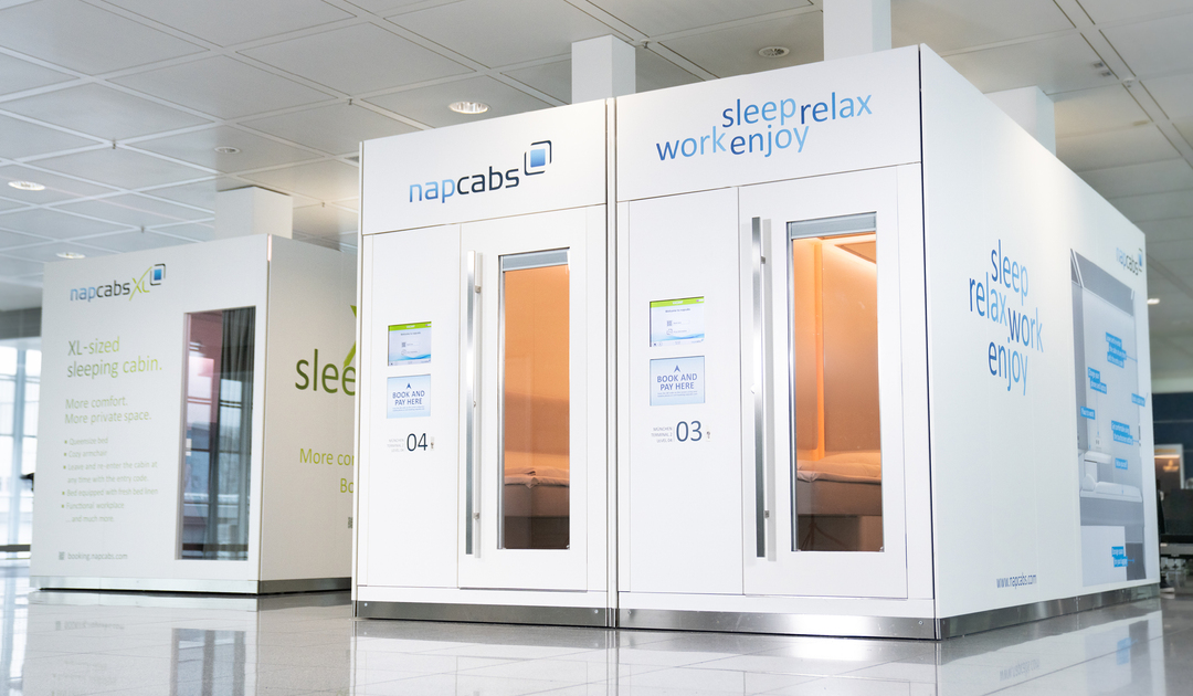 A cabin standing on the open terminal floor, Napcabs