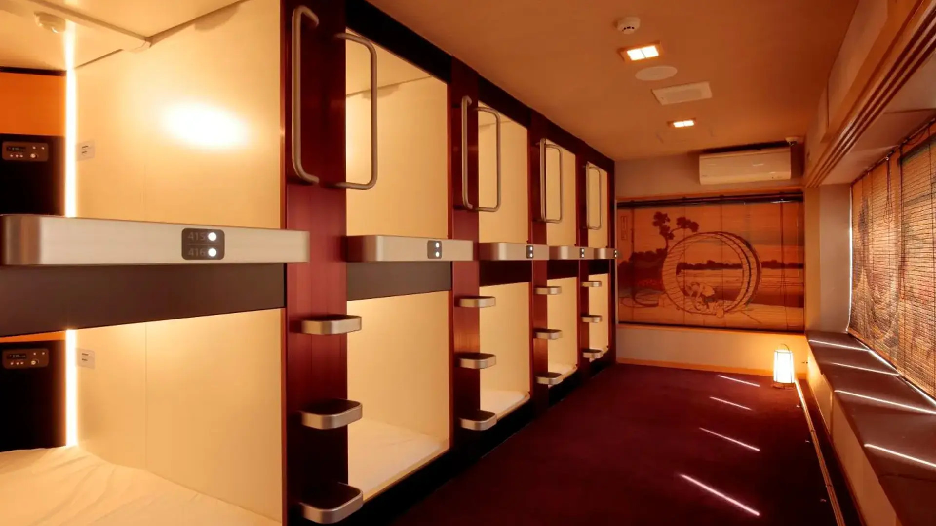 A row of sleeping cabins along a quiet corridor