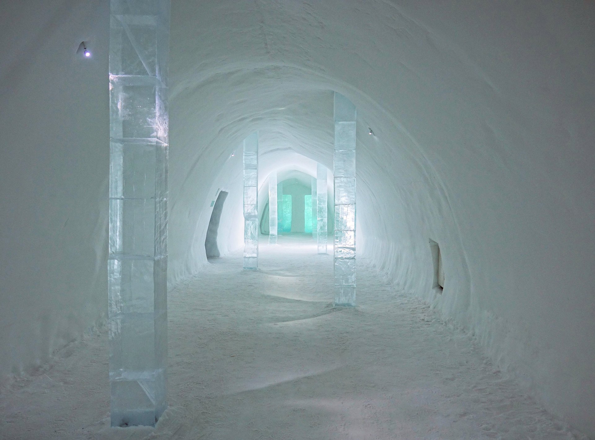 A vaulted corridor cut from river ice, Icehotel